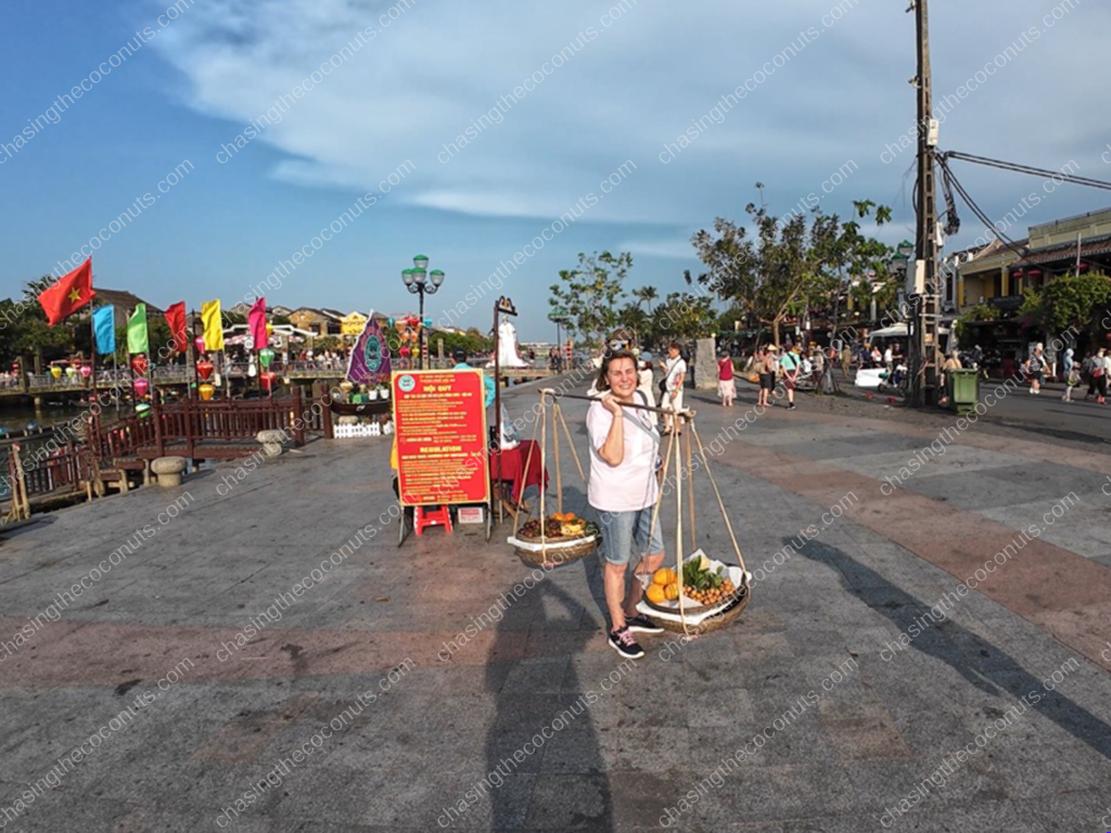 Toni Carrying the Bamboo Pole in Hội An