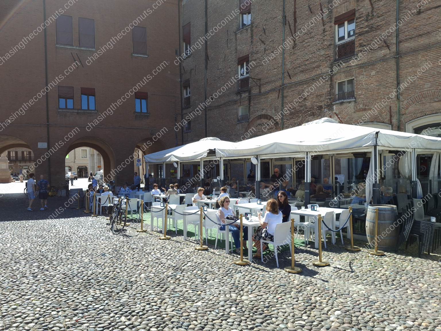 Sunlit Outdoor Cafe in Cobblestone Plaza